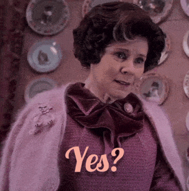 a woman in a purple sweater is asking the question " yes "