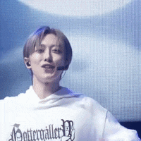 a man wearing a white sweater with the word potter on it
