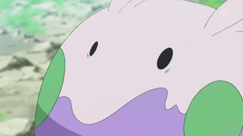 a close up of a cartoon character 's face with a green mouth
