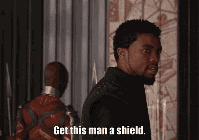 a man says " get this man a shield " while standing next to another man