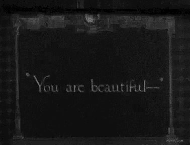 a black and white photo of a sign that says you are beautiful .