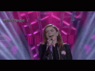 a pixelated image of a woman singing into a microphone with a purple background and the word destroyyou on the bottom