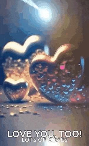 a couple of hearts with the words `` love you too lots of kisses '' written on it