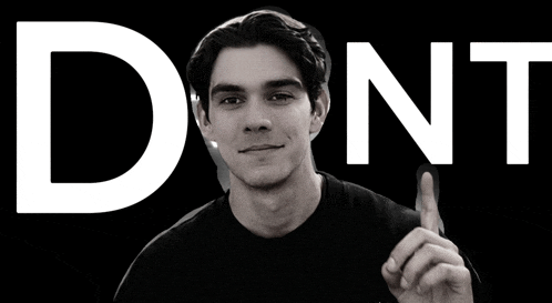 a man giving a thumbs up in front of the word " dont "