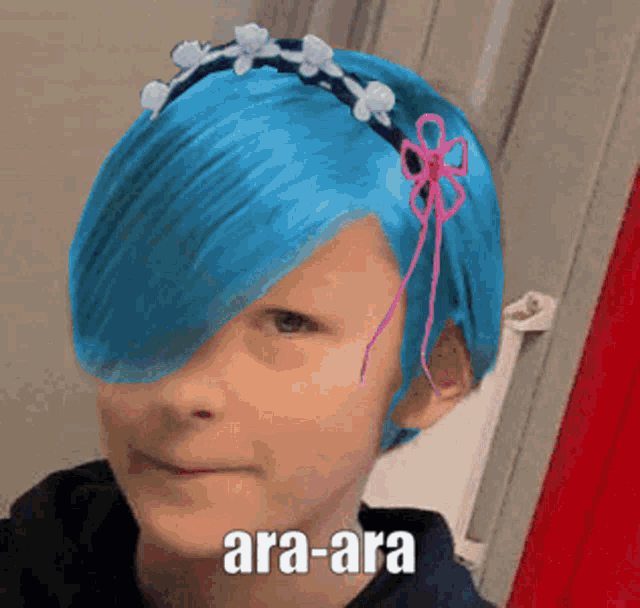 a person with blue hair and a headband that says ara ara