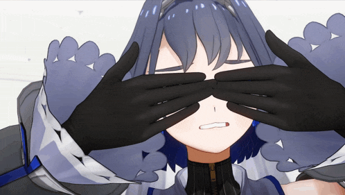 a girl covering her eyes with her hands while making a face