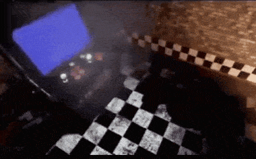 a black and white checkered floor with a blue screen in the background .