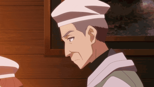 a man with gray hair and a white hat is looking to the side