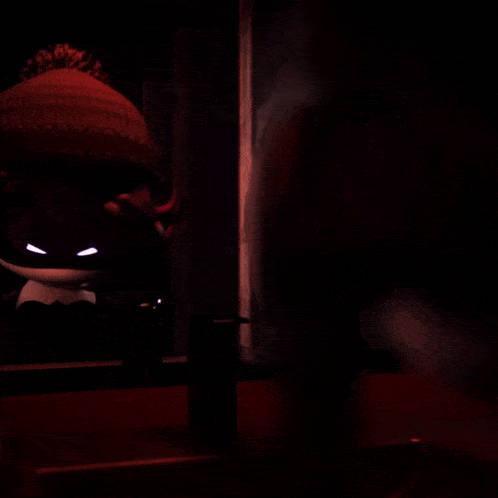 a person 's hand is reaching out towards a cartoon character