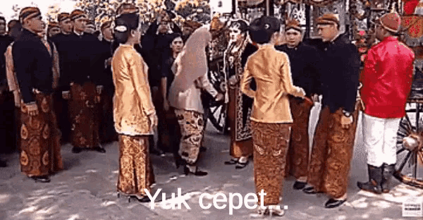 a group of people are standing in a circle with the words yuk cepet written on the bottom .