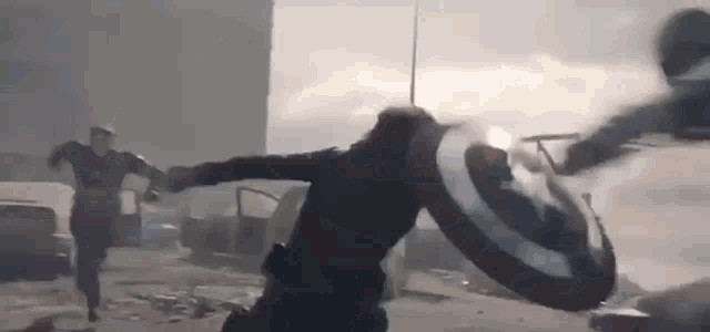 captain america and black widow are fighting each other in the avengers endgame .