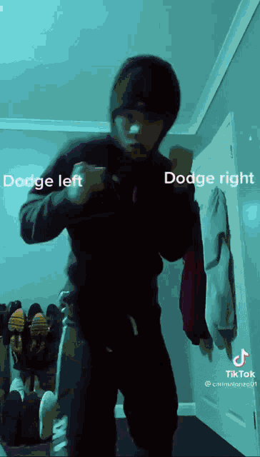 a man in a black hoodie is dancing with the words dodge left and dodge right above him