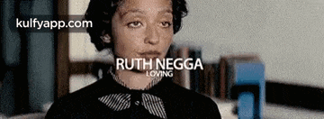 a close up of a woman 's face with the words `` ruth negga loving '' on it .