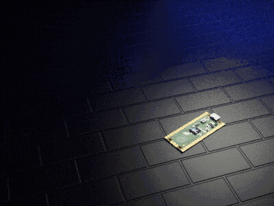 a small electronic device is laying on a black tile floor