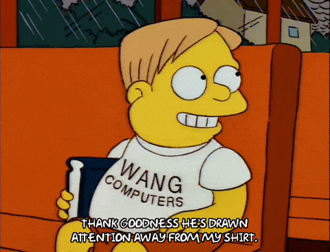 a cartoon character wearing a wang computers t-shirt