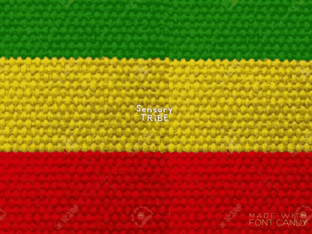 a red , yellow , and green knitted fabric with the words sensory tribe on it .