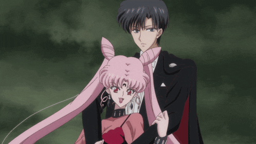 a man and a woman are standing next to each other in a dark room