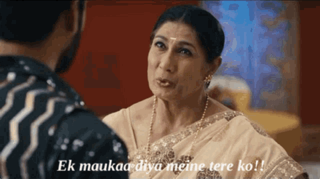 a woman talking to a man with the words " ek maukaa diya meine tere ko " above her