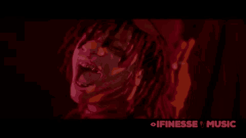 a close up of a person 's face with the words ifinesse music above it