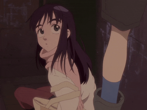 a girl with purple hair is being held by a person 's leg