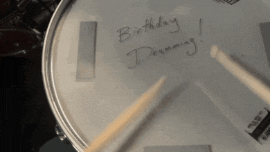 a drum with a note that says birthday drumming