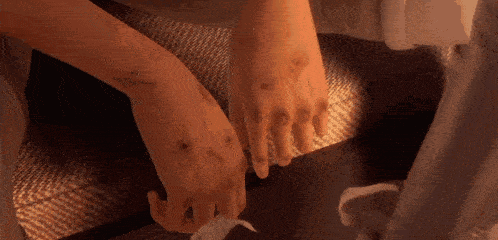a close up of a person 's wrists with a few stitches on them