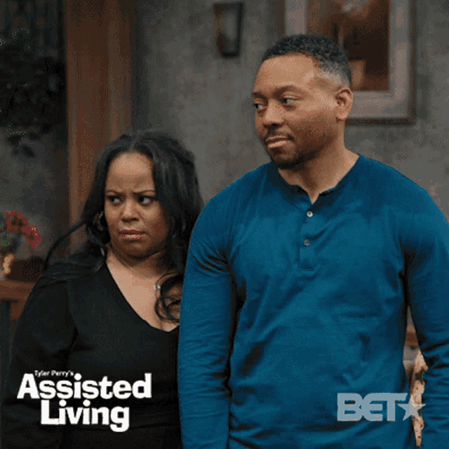 a man and a woman are standing next to each other with the words assisted living on the bottom