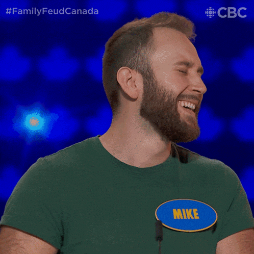 a man with a beard and a name tag that says mike on it