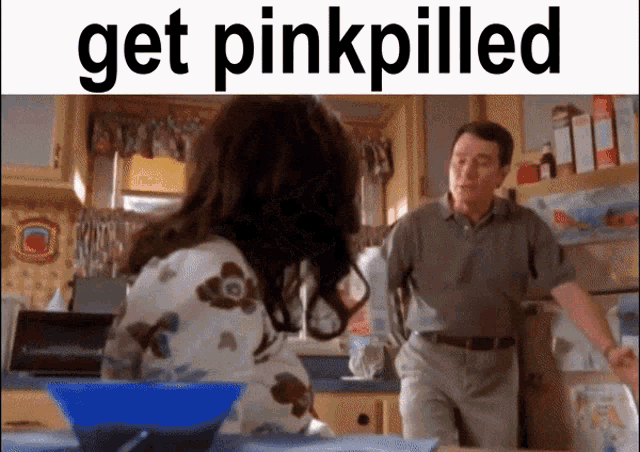 a man and a woman are in a kitchen with the words get pinkpilled above them