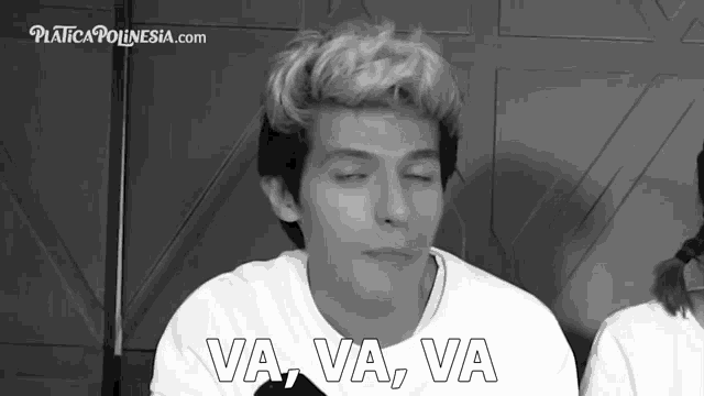 a black and white photo of a man with the words va va va