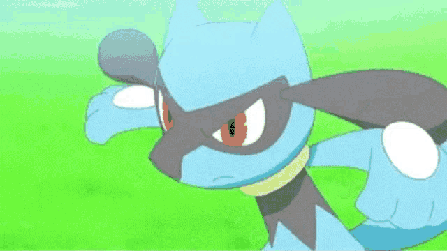 a blue pokemon with red eyes is standing in the grass .