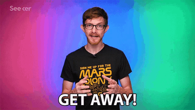 a man wearing a sign me up for the mars colony t-shirt says get away