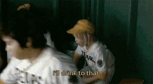 a boy in a baseball uniform says i 'll drink to that