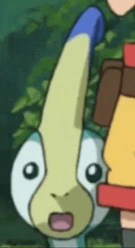 a close up of a cartoon character with a surprised expression on its face .