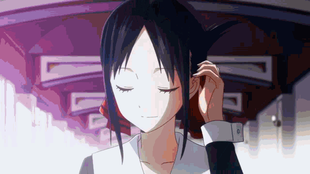 a close up of a girl with her eyes closed