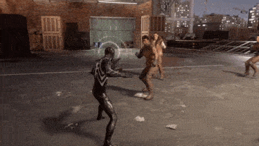 a group of people are playing a video game and one of them is a spiderman