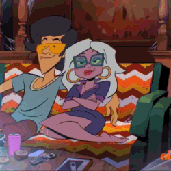 a man and a woman are sitting on a colorful couch