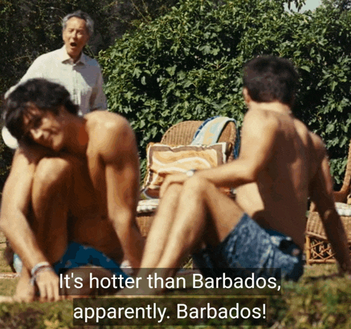 a group of men sitting in the grass with the caption " it 's hotter than barbados "