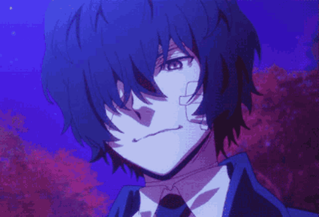 a person with a bandage on their face is wearing a suit and tie