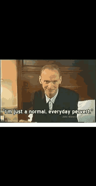 a man in a suit is smiling with the words normal everyday pervert below him