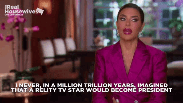 a woman in a pink suit is talking about reality tv star being president