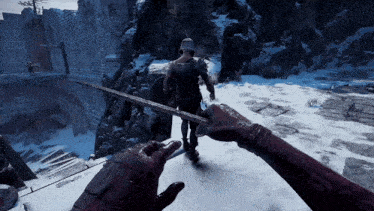 a person holding a sword in a video game while another person holds a shield
