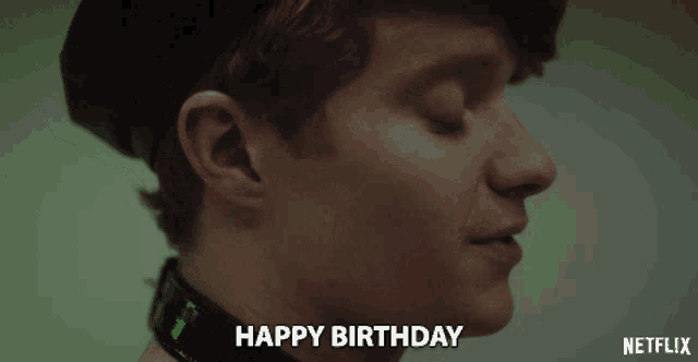 a close up of a man 's face with the words happy birthday above him