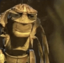a close up of a bug from a cartoon with a serious look on its face .