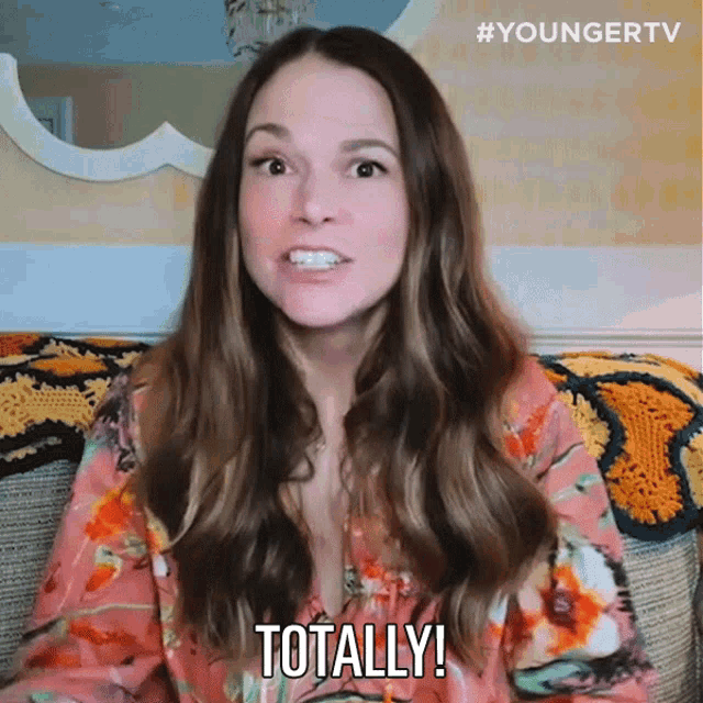 a woman sitting on a couch with the words totally written on her face