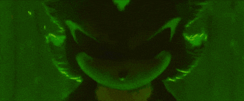 a close up of a sonic the hedgehog 's eyes that are glowing in the dark .