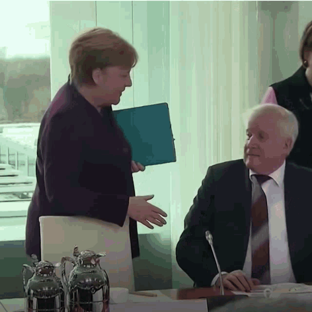 Angela Merkel Handshake GIF - Angela Merkel Handshake Virus GIFs