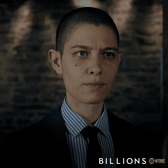 a showtime ad for billions features a woman in a suit and tie