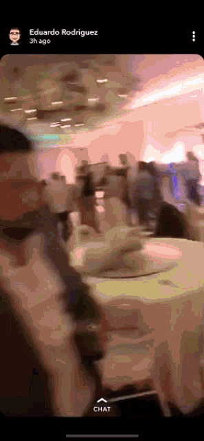 a screenshot of eduardo rodriguez 's snapchat showing a group of people sitting at tables