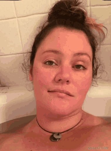 a woman in a bathtub with muglife.com written in the corner
